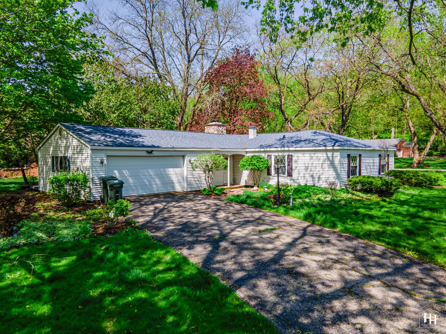 239 Brookbridge Road Trout Valley, IL 60013 - Photo 1 of 24 a front view of a house with garden