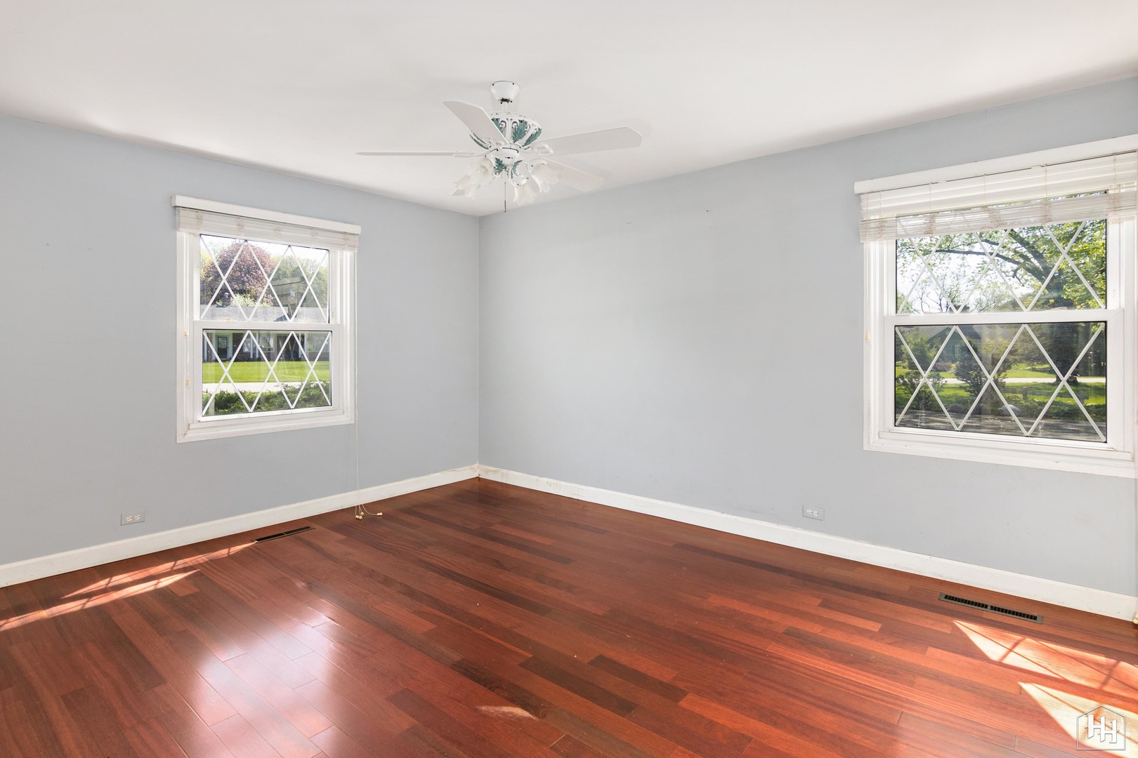 239 Brookbridge Road Trout Valley, IL 60013 - Photo 11 of 24 a view of an empty room with wooden floor and a window