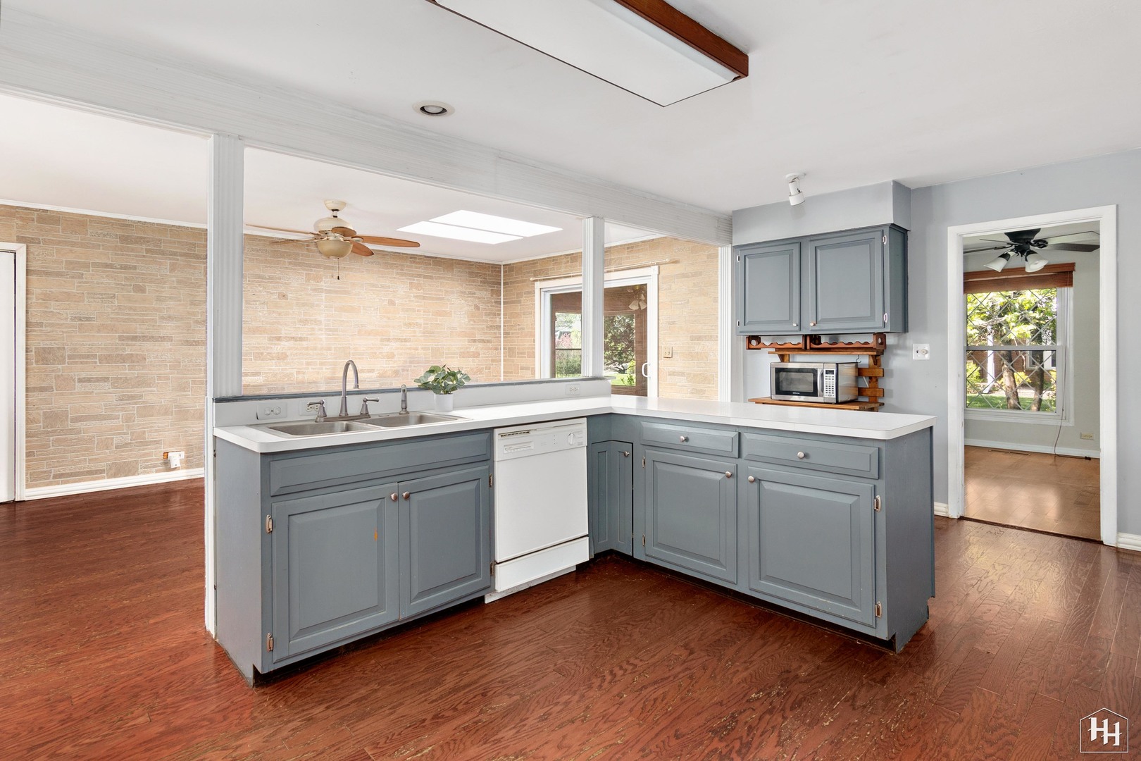239 Brookbridge Road Trout Valley, IL 60013 - Photo 10 of 24 a kitchen with sink cabinets and wooden floor