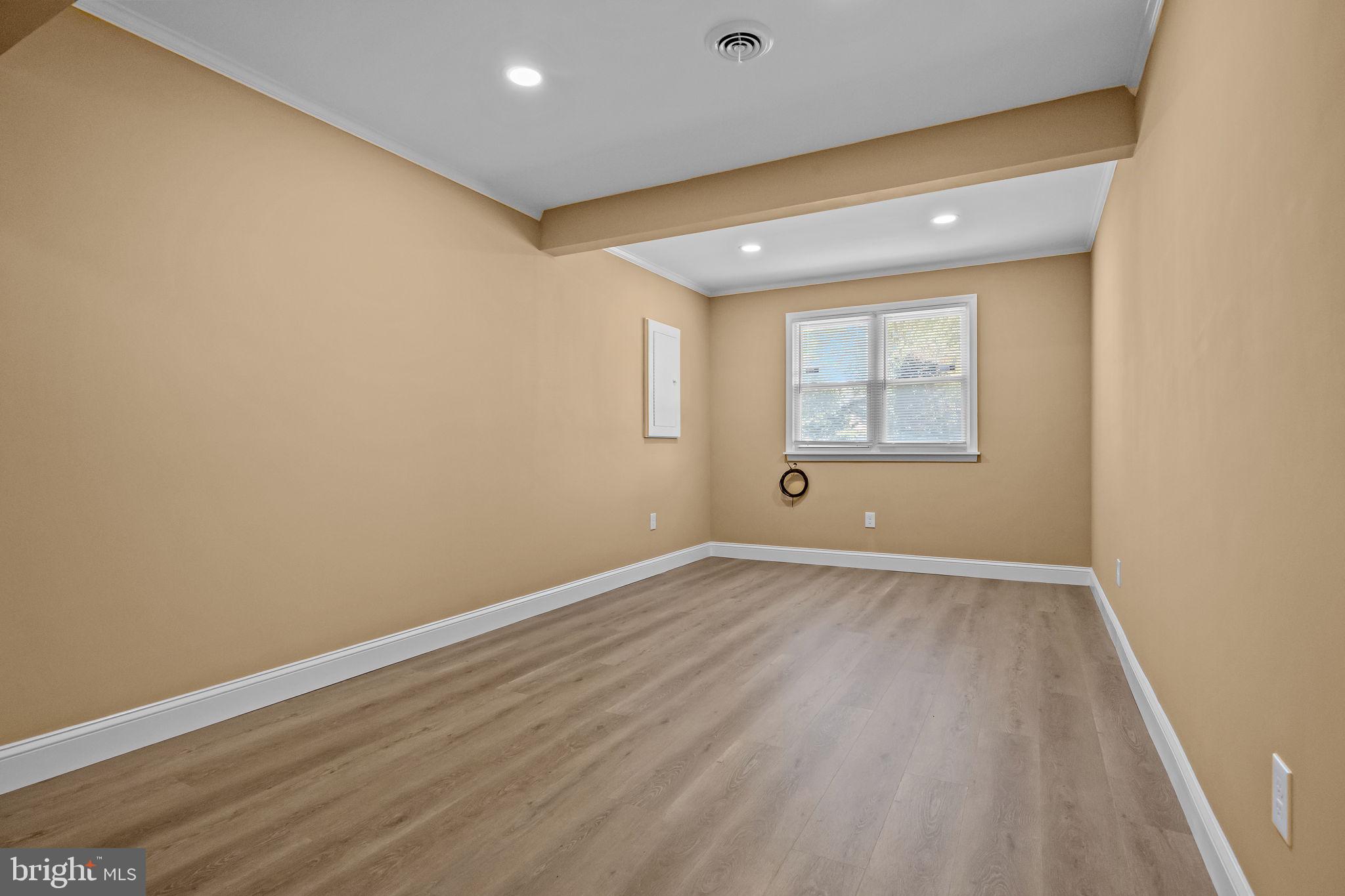 1838 Sheri Road Bensalem, PA 19020 - Photo 18 of 43 an empty room with wooden floor and windows