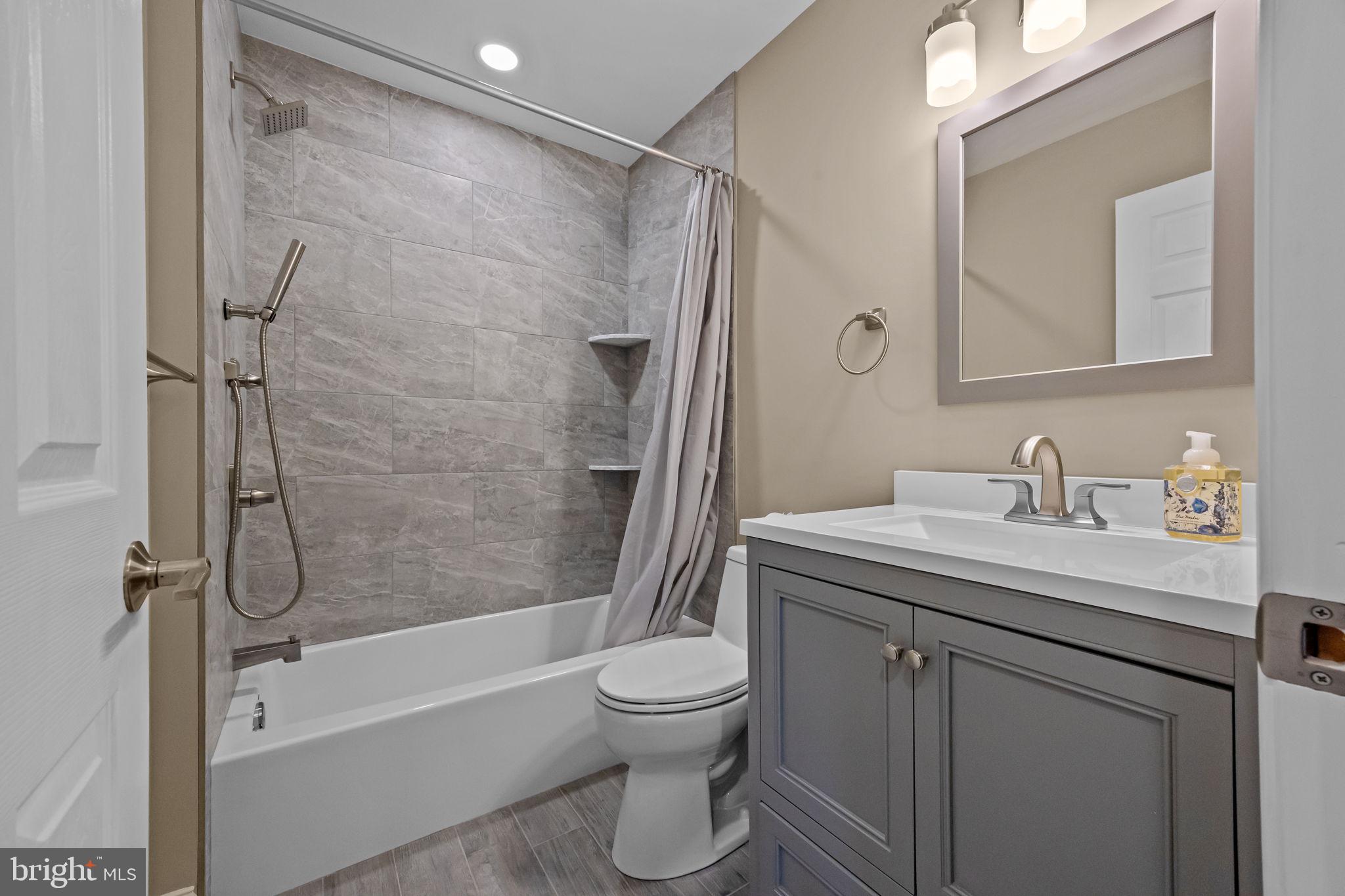 1838 Sheri Road Bensalem, PA 19020 - Photo 28 of 43 a bathroom with a granite countertop sink toilet and shower