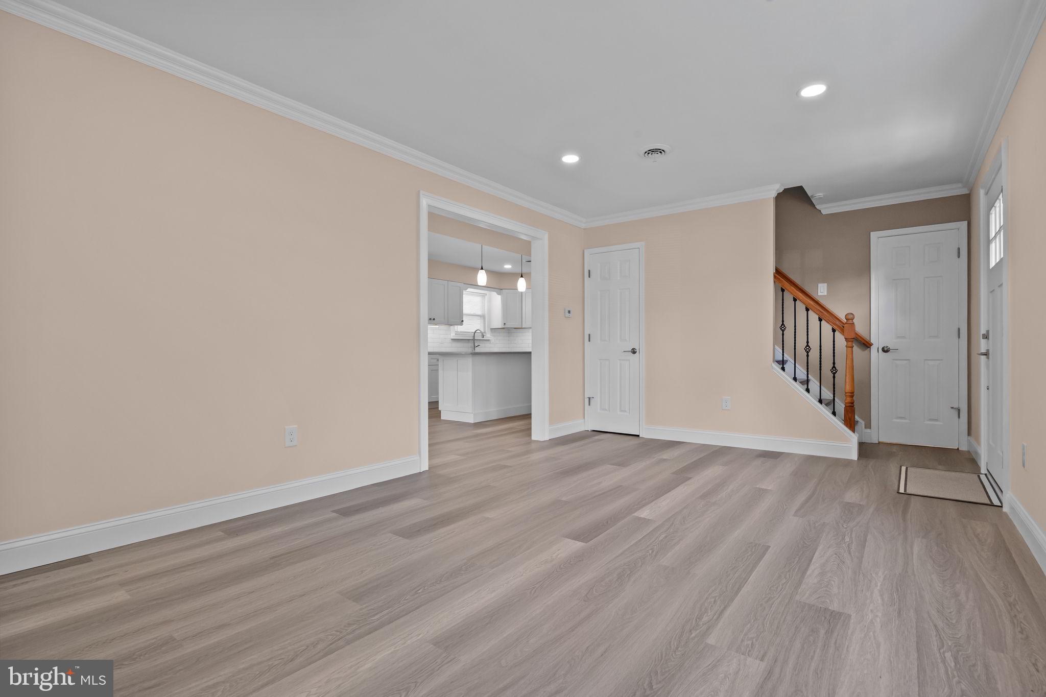 1838 Sheri Road Bensalem, PA 19020 - Photo 5 of 43 a view of an empty room with wooden floor and a window