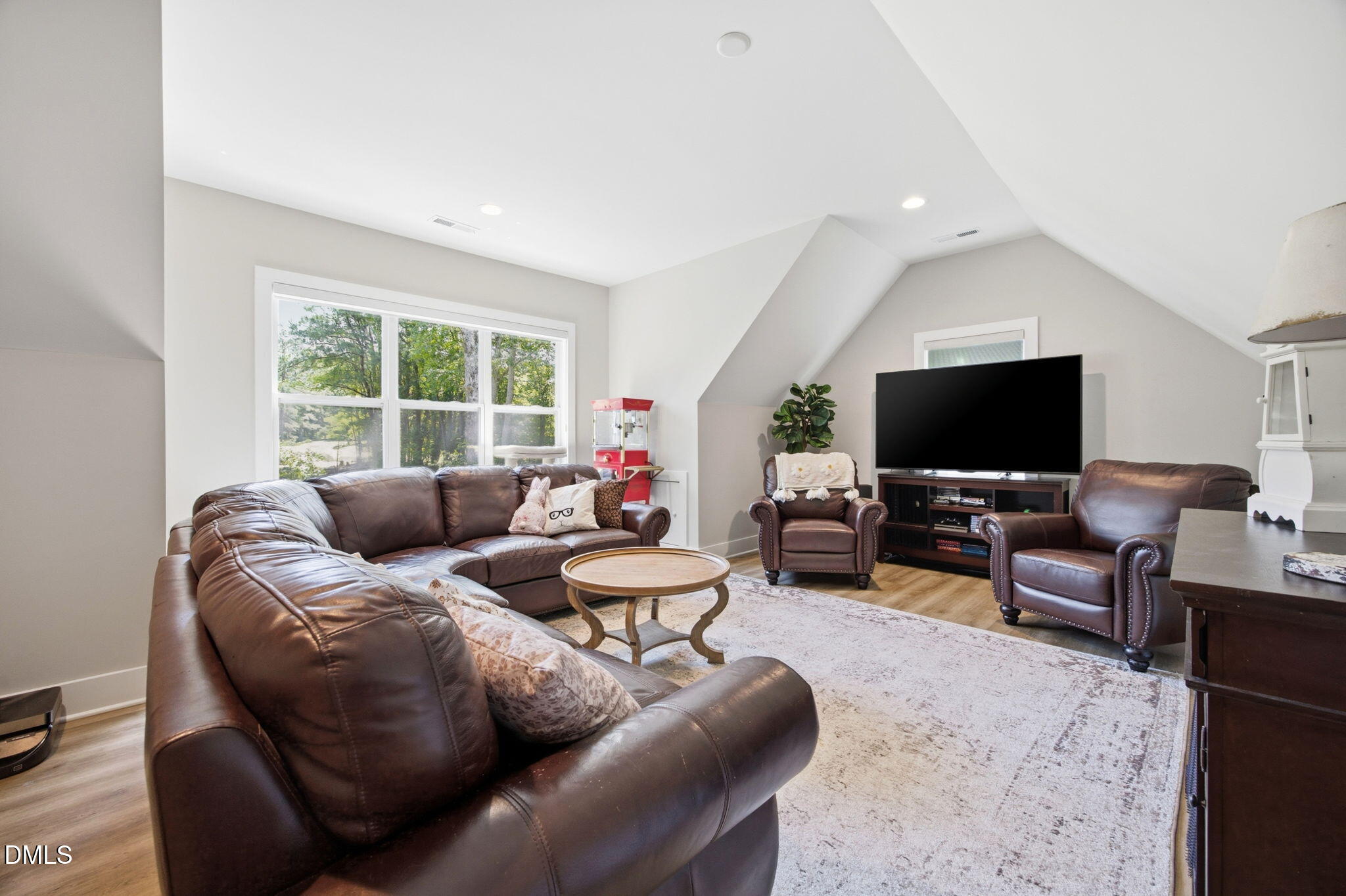 3511 Bruce Garner Road Wake Forest, NC 27587 - Photo 36 of 56 a living room with furniture and a flat screen tv