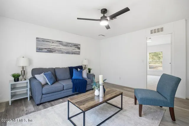 a living room with furniture and a window
