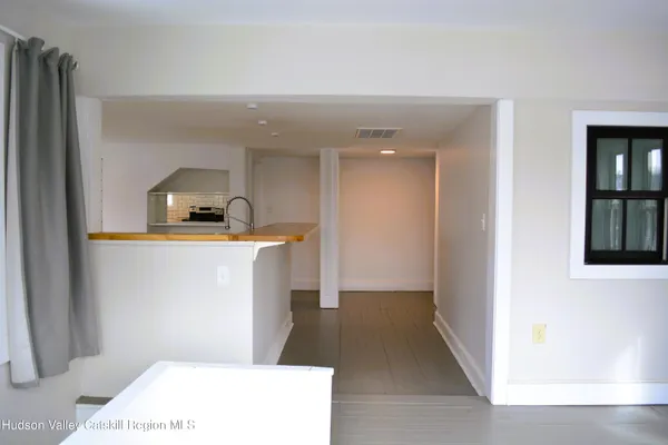 a hallway with a washer and dryer