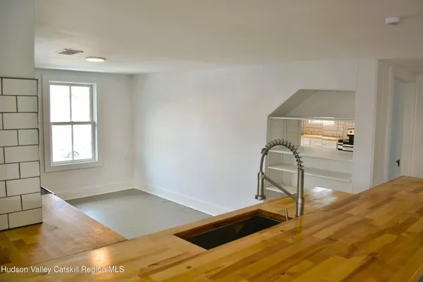 a room with gym equipment and a window