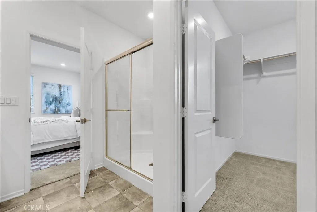 5584 Kate Way, Unit 10 Fontana, CA 92335 - Photo 17 of 42 a en suite bathroom with a shower and a sink