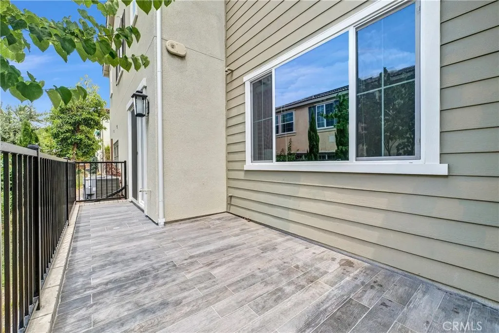 5584 Kate Way, Unit 10 Fontana, CA 92335 - Photo 27 of 42 a view of house with backyard and wooden floor