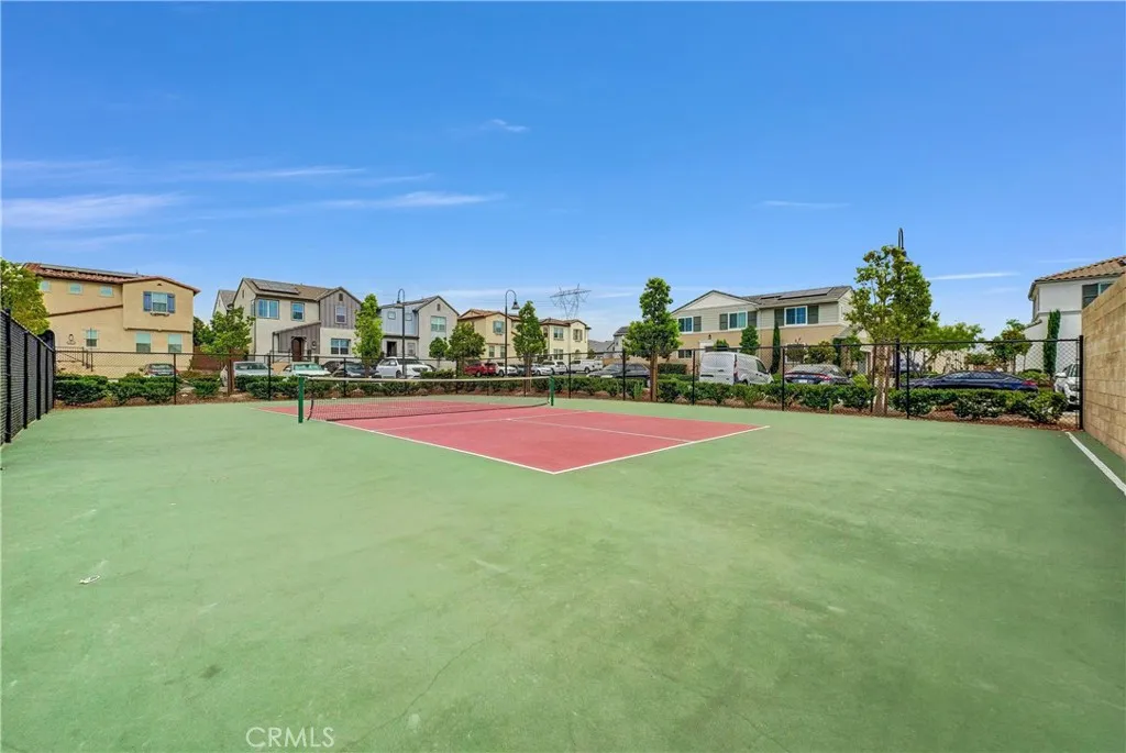 5584 Kate Way, Unit 10 Fontana, CA 92335 - Photo 30 of 42 a view of green field with house in the background