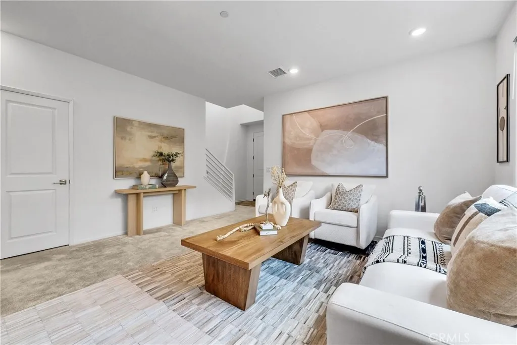 5584 Kate Way, Unit 10 Fontana, CA 92335 - Photo 3 of 42 a living room with furniture and view of kitchen