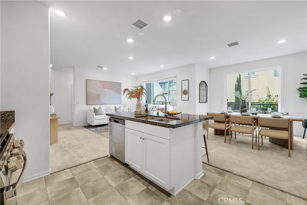 5584 Kate Way, Unit 10 Fontana, CA 92335 - Photo 8 of 42 a living room with furniture a window and a table