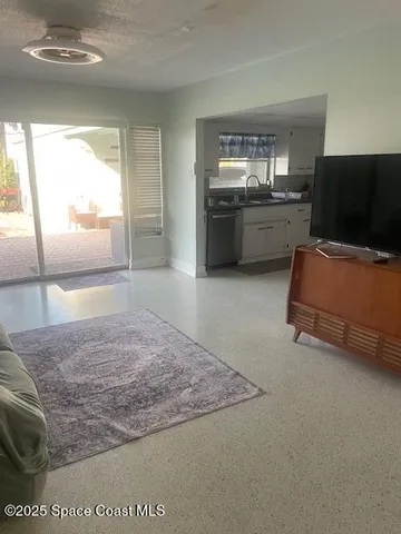 a view of hotel and patio in the background