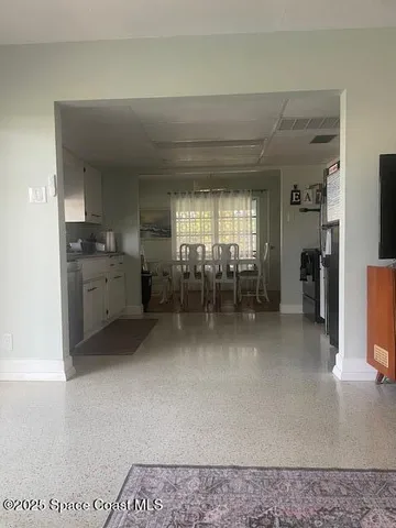 a kitchen with a sink cabinets and window
