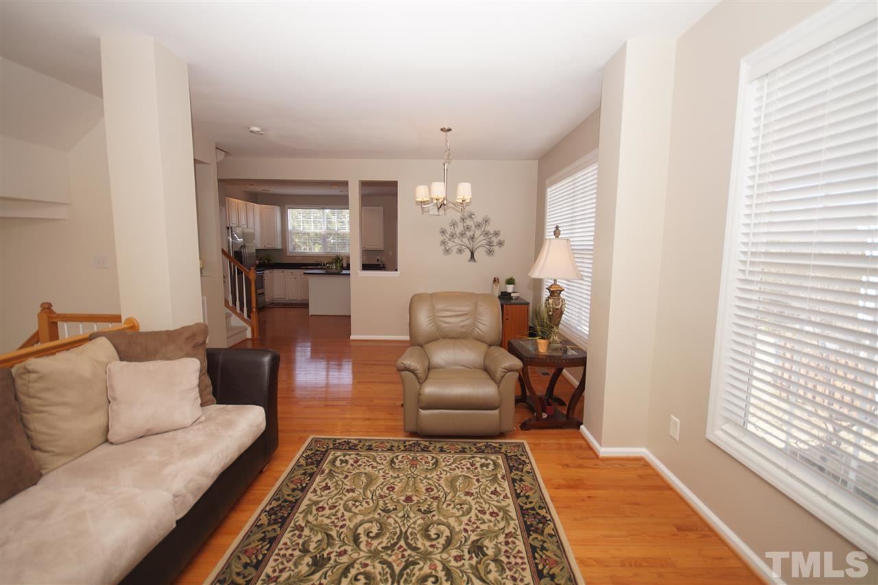 5202 Echo Ridge Road Raleigh, NC 27612 - Photo 7 of 22 a living room with furniture and a rug