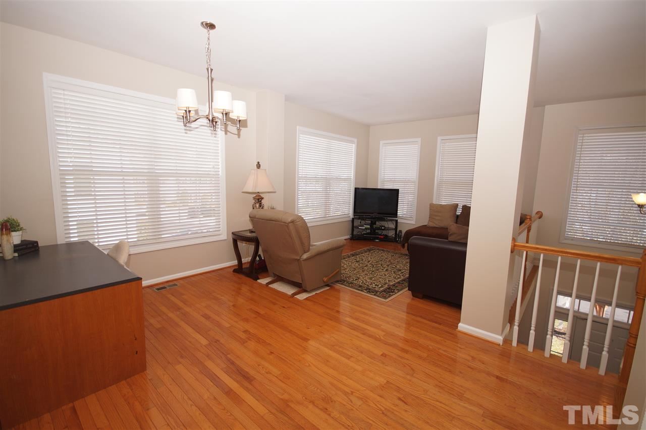 5202 Echo Ridge Road Raleigh, NC 27612 - Photo 8 of 22 a view of a livingroom with furniture window and wooden floor