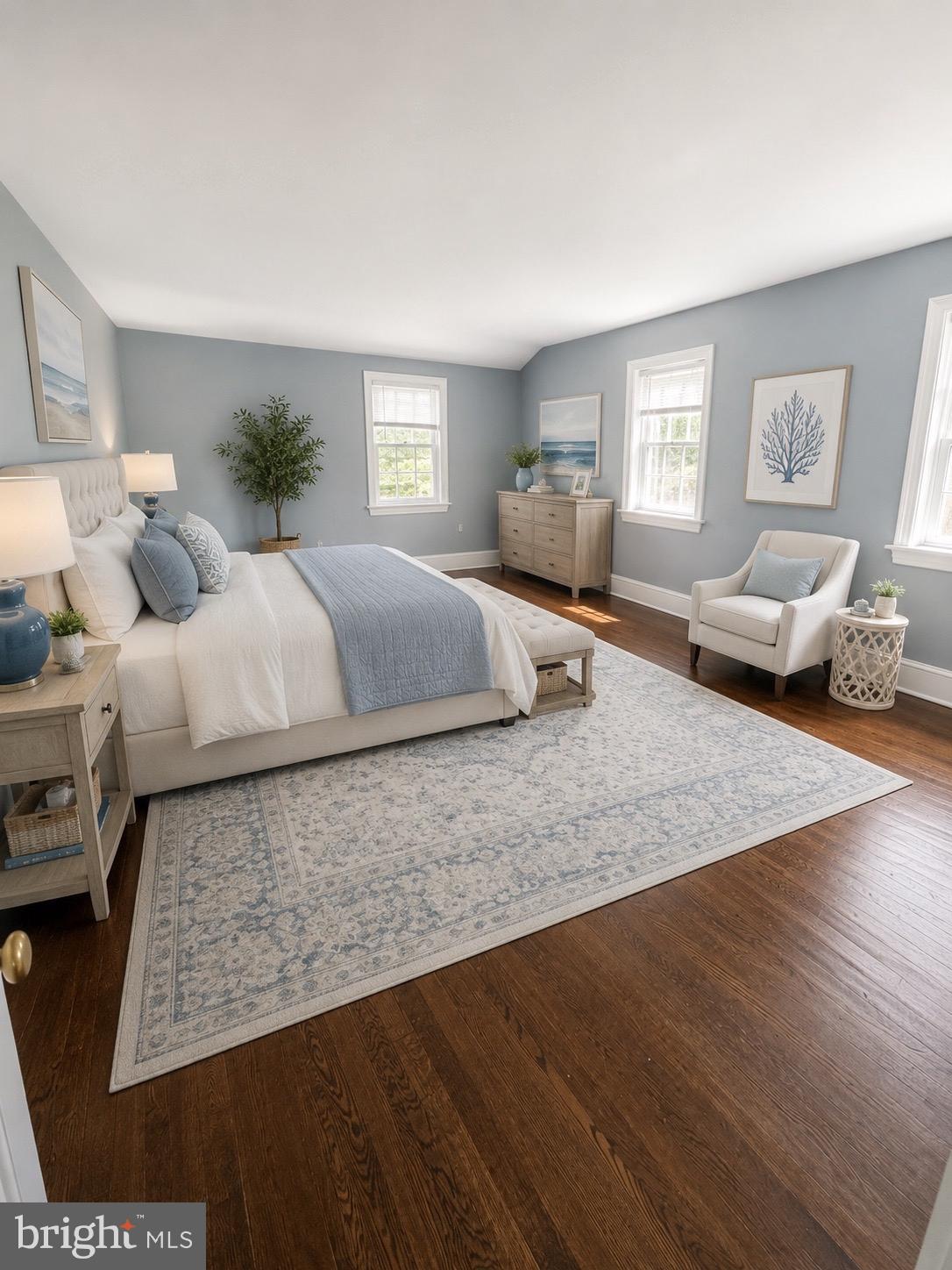 504 Conshohocken State Road Gladwyne, PA 19035 - Photo 7 of 20 a bedroom with a large bed and wooden floor