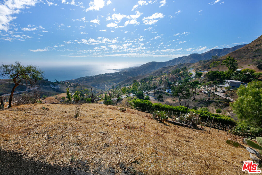 21800 Azurelee Drive Malibu, CA 90265 - Photo 12 of 21 a view of a road with mountains in the background