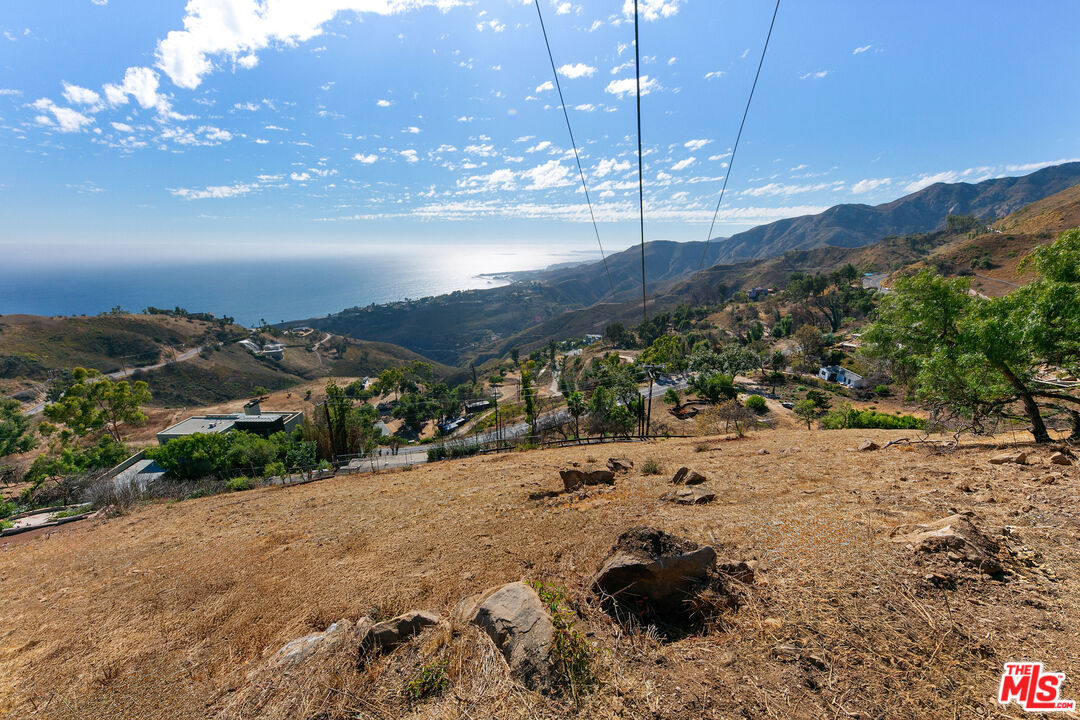 21800 Azurelee Drive Malibu, CA 90265 - Photo 13 of 21 a view of a lake with a mountain
