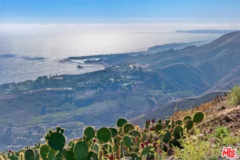 a view of an chairs and television
