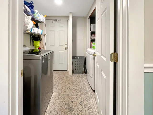 a view of a kitchen from the hallway