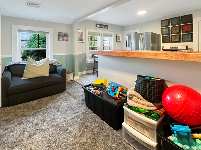 a living room with furniture and window