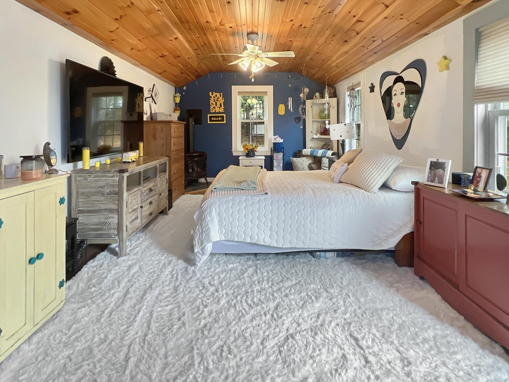 1649 Washington Street Canton, MA 02021 - Photo 15 of 38 a living room with furniture a flat screen tv and a large window