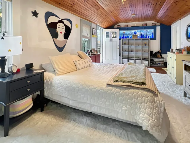 a bed room with a bed and a walk in closet