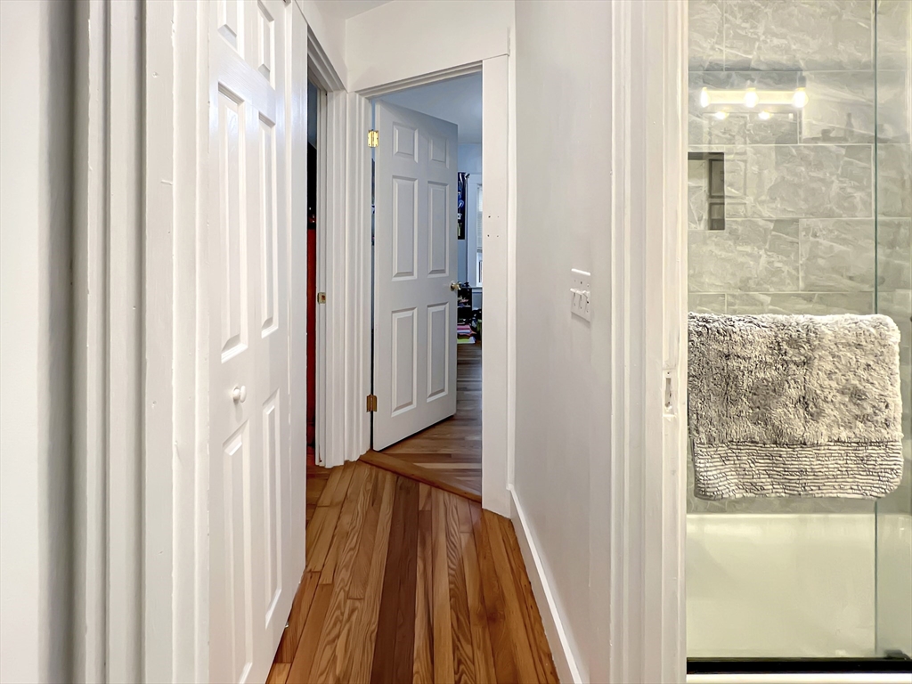 1649 Washington Street Canton, MA 02021 - Photo 22 of 38 a view of a bathroom from a hallway