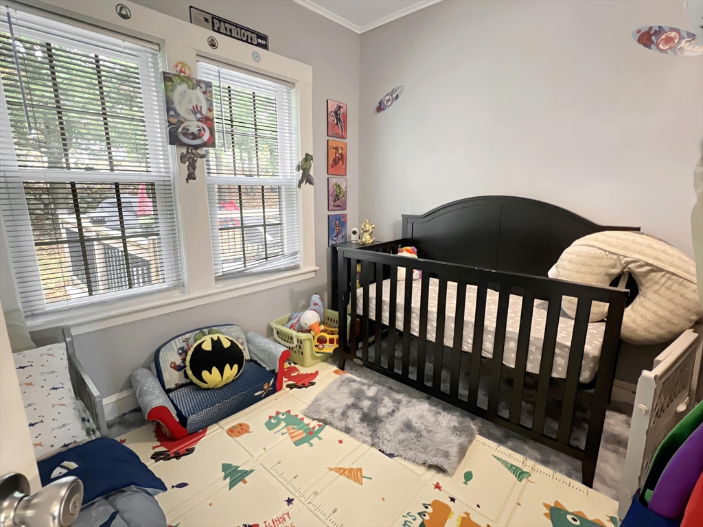 1649 Washington Street Canton, MA 02021 - Photo 24 of 38 a bedroom with two beds and a dresser