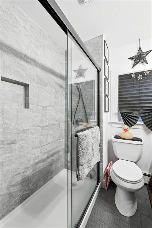 1649 Washington Street Canton, MA 02021 - Photo 27 of 38 a bathroom with a toilet a sink and shower