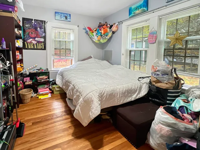 a bedroom with furniture and a window