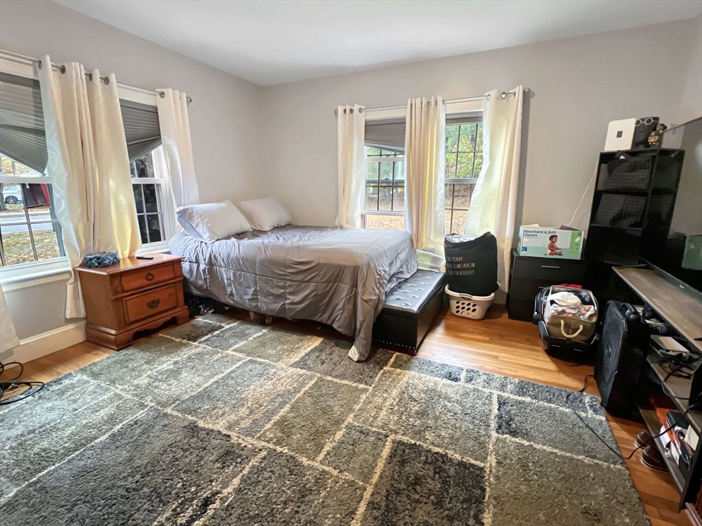 1649 Washington Street Canton, MA 02021 - Photo 29 of 38 a bedroom with furniture and a window
