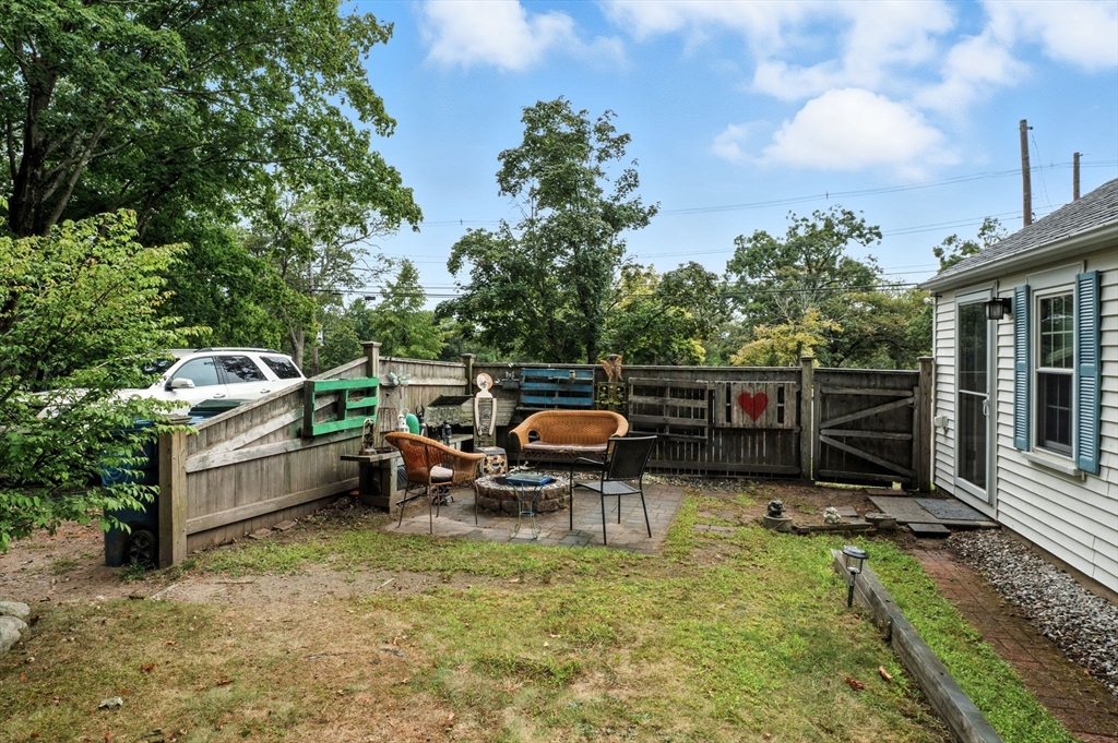 1649 Washington Street Canton, MA 02021 - Photo 38 of 38 a backyard of a house with barbeque oven and outdoor seating