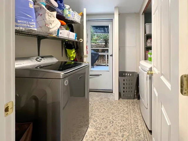 a kitchen with stainless steel appliances granite countertop a refrigerator and a stove