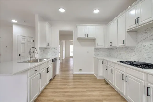 a view of a hallway with entryway door