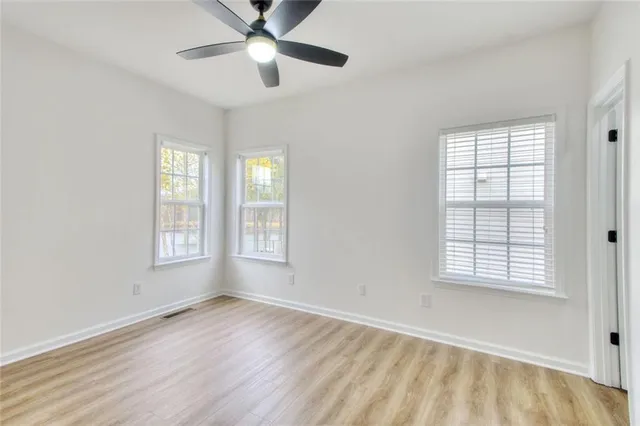 a white bath tub sitting next to a window