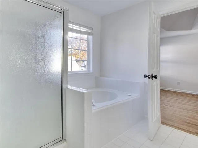 a view of an empty room with a sliding door