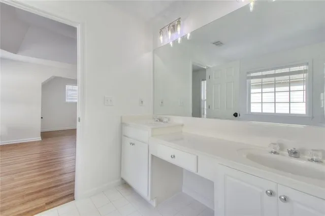 a view of a balcony with wooden floor and door