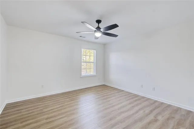 a view of a swimming pool with a yard and a fire pit