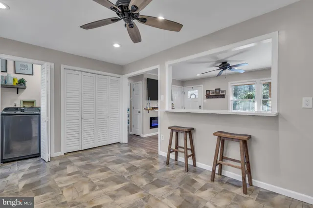 a view of kitchen with workspace and window