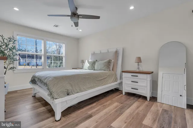 a bedroom with a bed and a dresser