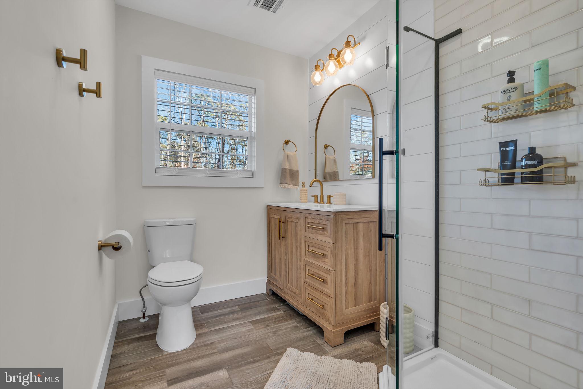 116 Polly Pod Road West Creek, NJ 08092 - Photo 18 of 33 a bathroom with a sink a toilet and a mirror