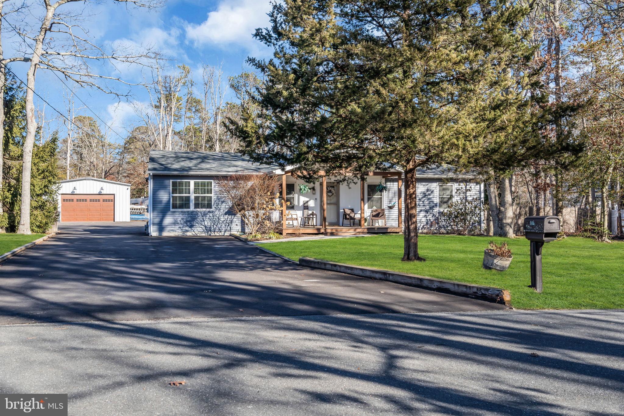 116 Polly Pod Road West Creek, NJ 08092 - Photo 2 of 33 a front view of a house with a yard