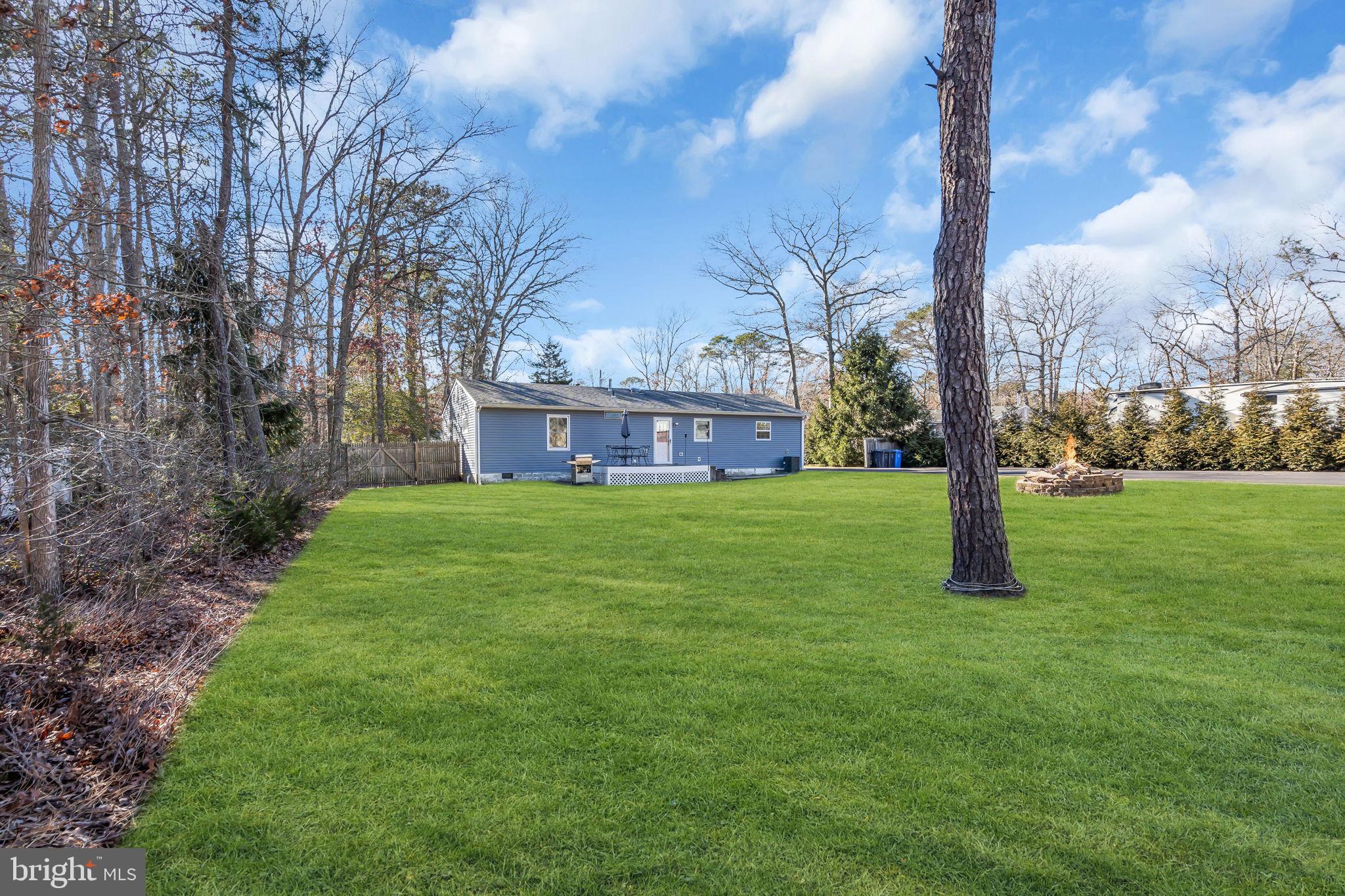 116 Polly Pod Road West Creek, NJ 08092 - Photo 23 of 33 a view of a house with a yard