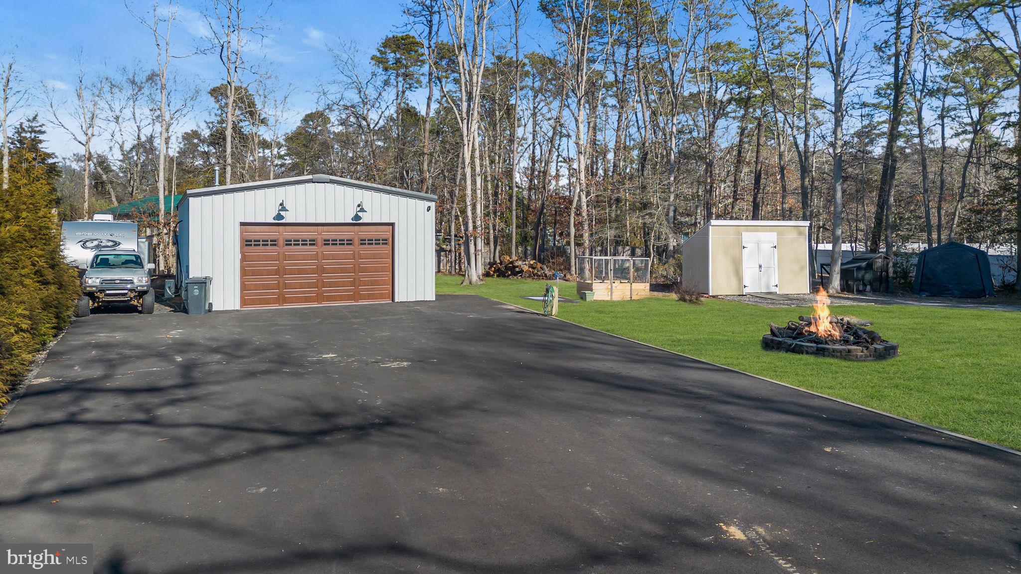 116 Polly Pod Road West Creek, NJ 08092 - Photo 27 of 33 a view of a house with a yard and pathway