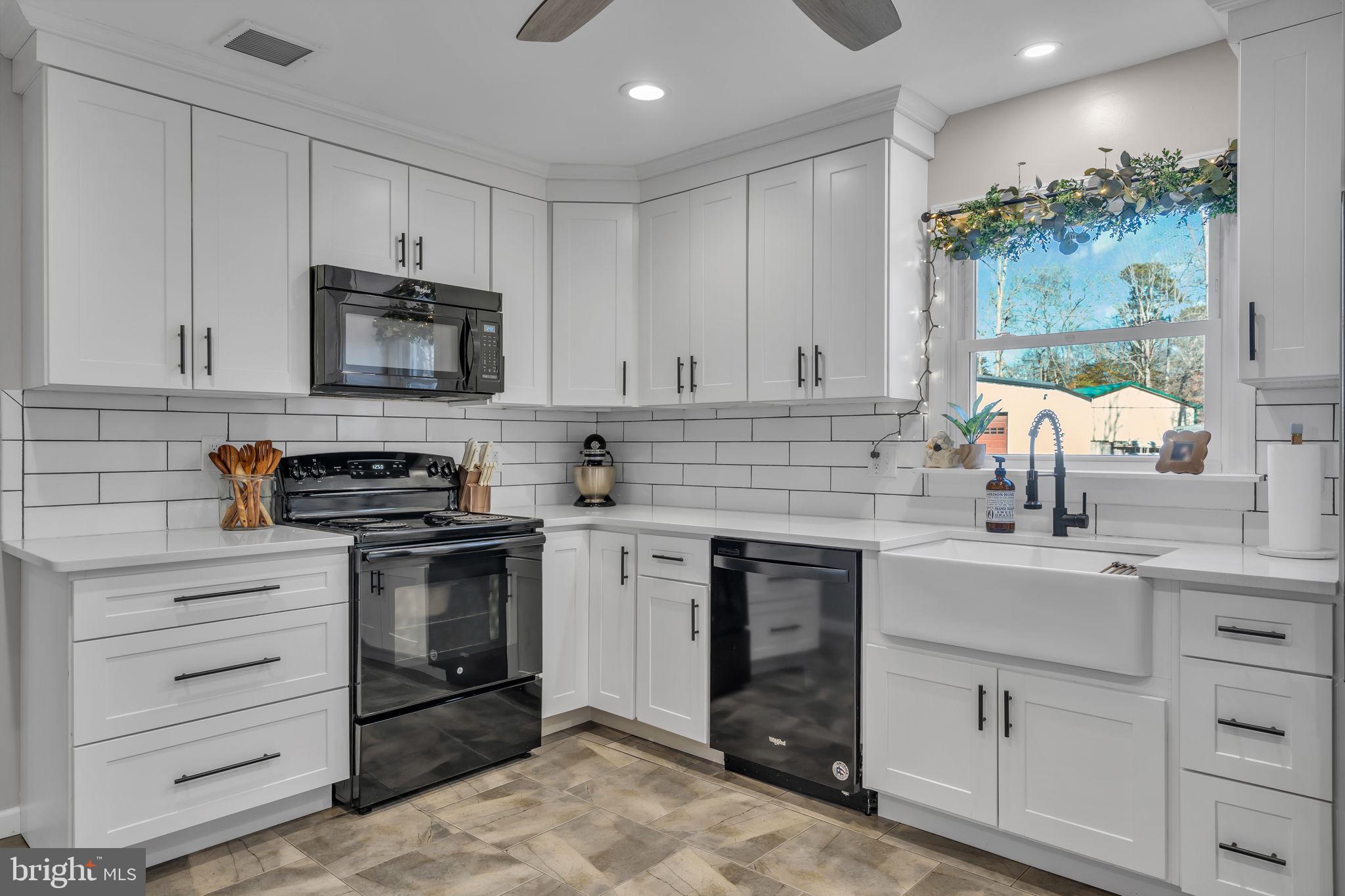 116 Polly Pod Road West Creek, NJ 08092 - Photo 10 of 33 a kitchen with cabinets stainless steel appliances and sink