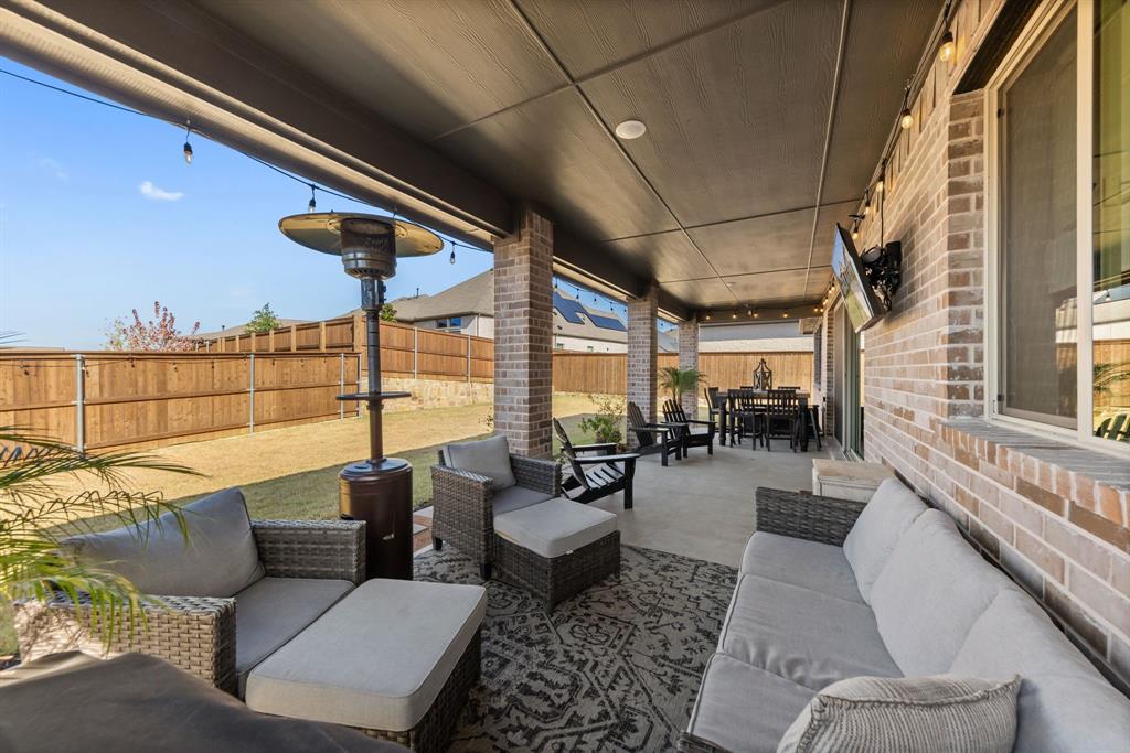1340 Cartona Road Fate, TX 75087 - Photo 24 of 32 a living room with furniture and a large window