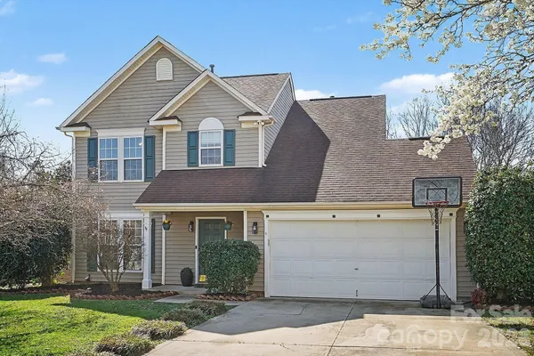 front view of a house with a yard