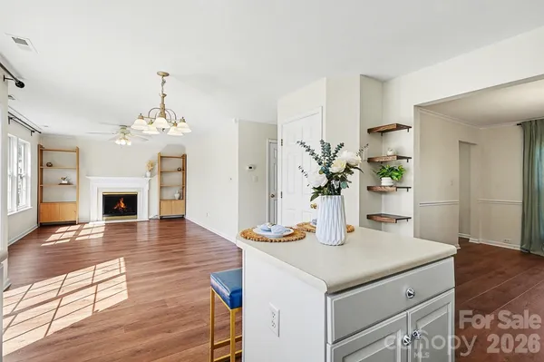 a kitchen with sink and refrigerator