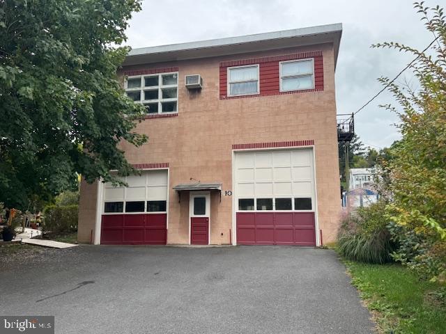 a front view of a house with garage